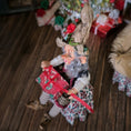 Load image into Gallery viewer, Decorative elf holding a gift box on a wooden surface with festive background
