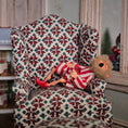 Load image into Gallery viewer, Yawning elf doll in pajamas lying on a patterned armchair with a blurred background
