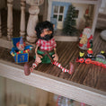 Load image into Gallery viewer, black-bearded elf dollhouse doll, surrounded by toys
