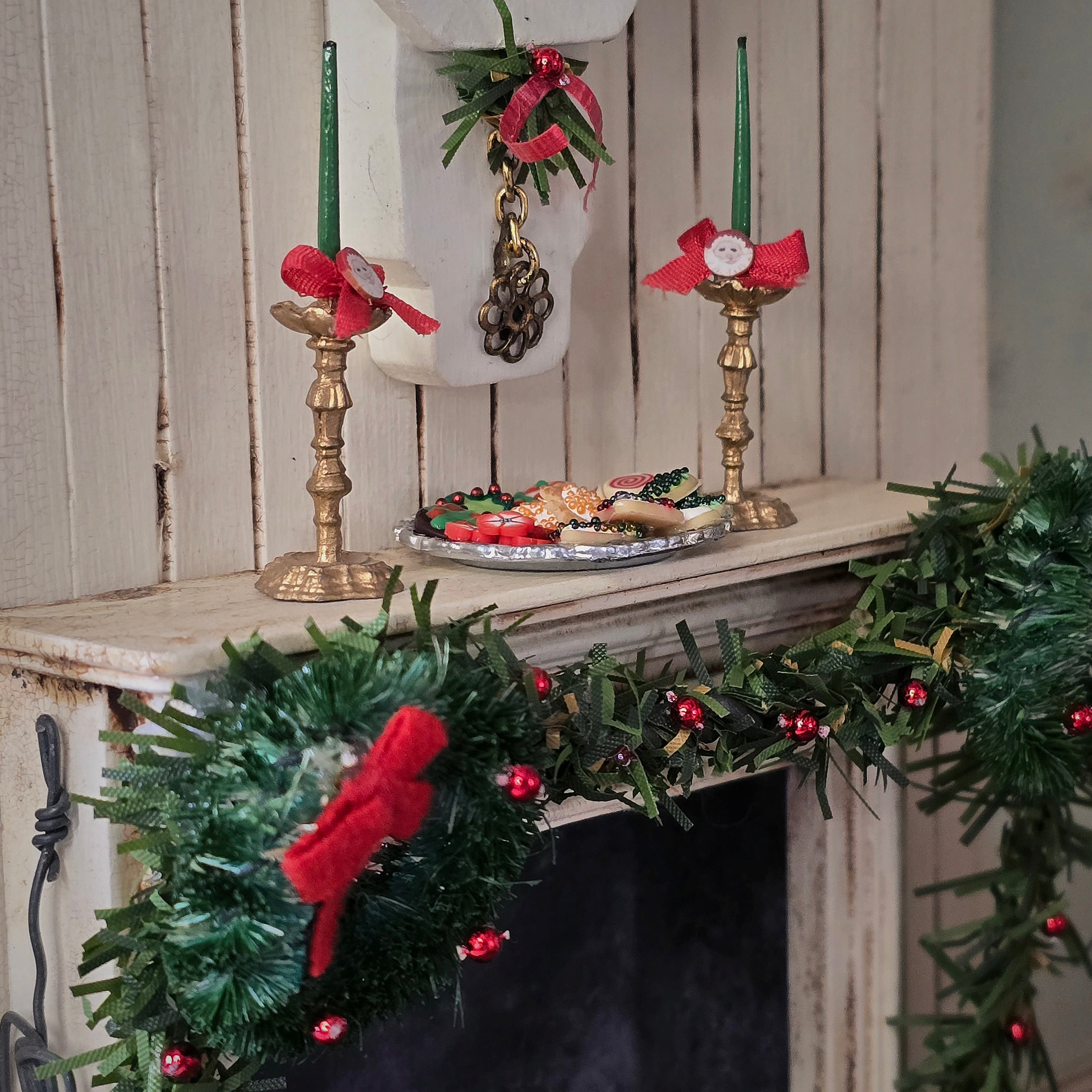 miniature dollhouse cookies on platter, on fireplace mantel