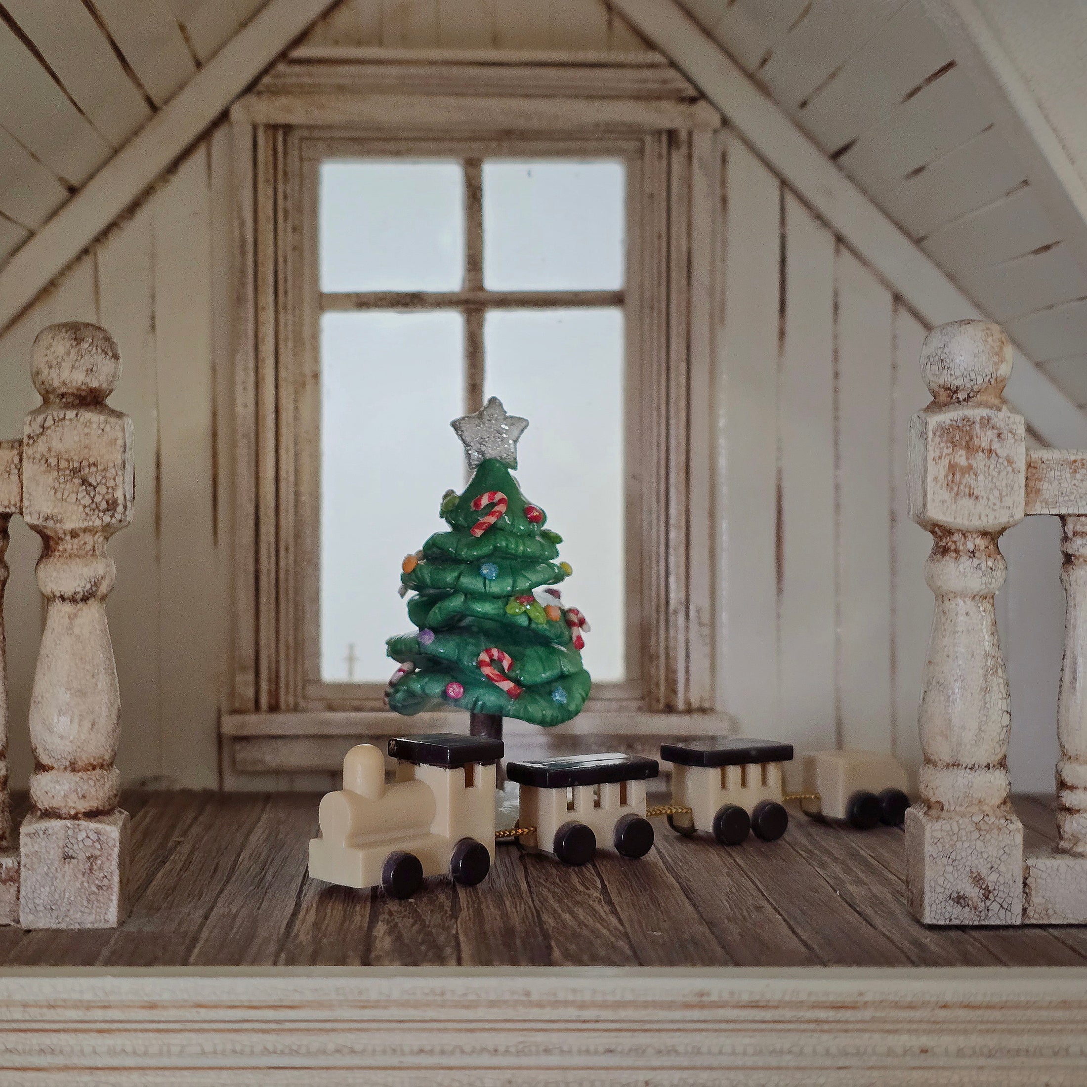 resin miniature toy train in country room