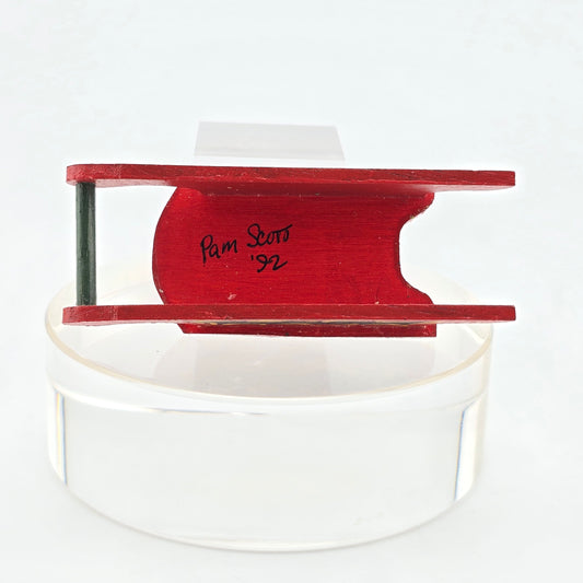 Signed back of Miniature Christmas Sled – Hand-Painted by Pam Scott