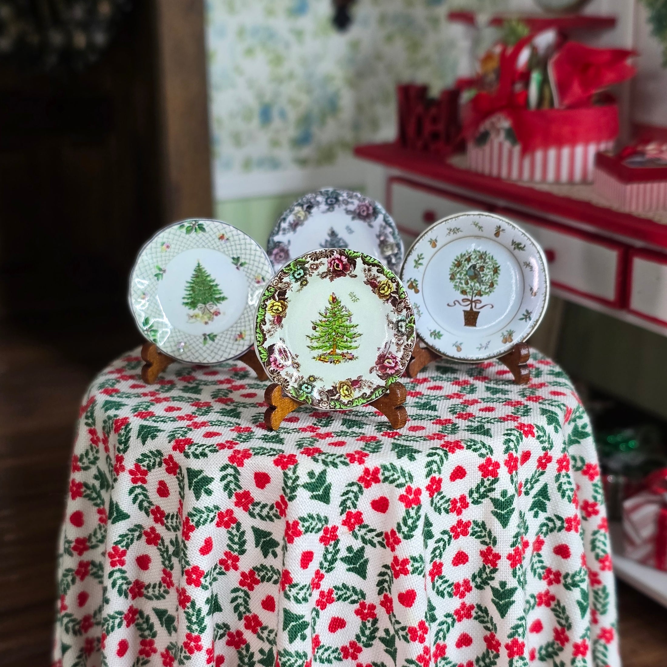 Decorative plates with Christmas designs on a tablecloth with floral pattern