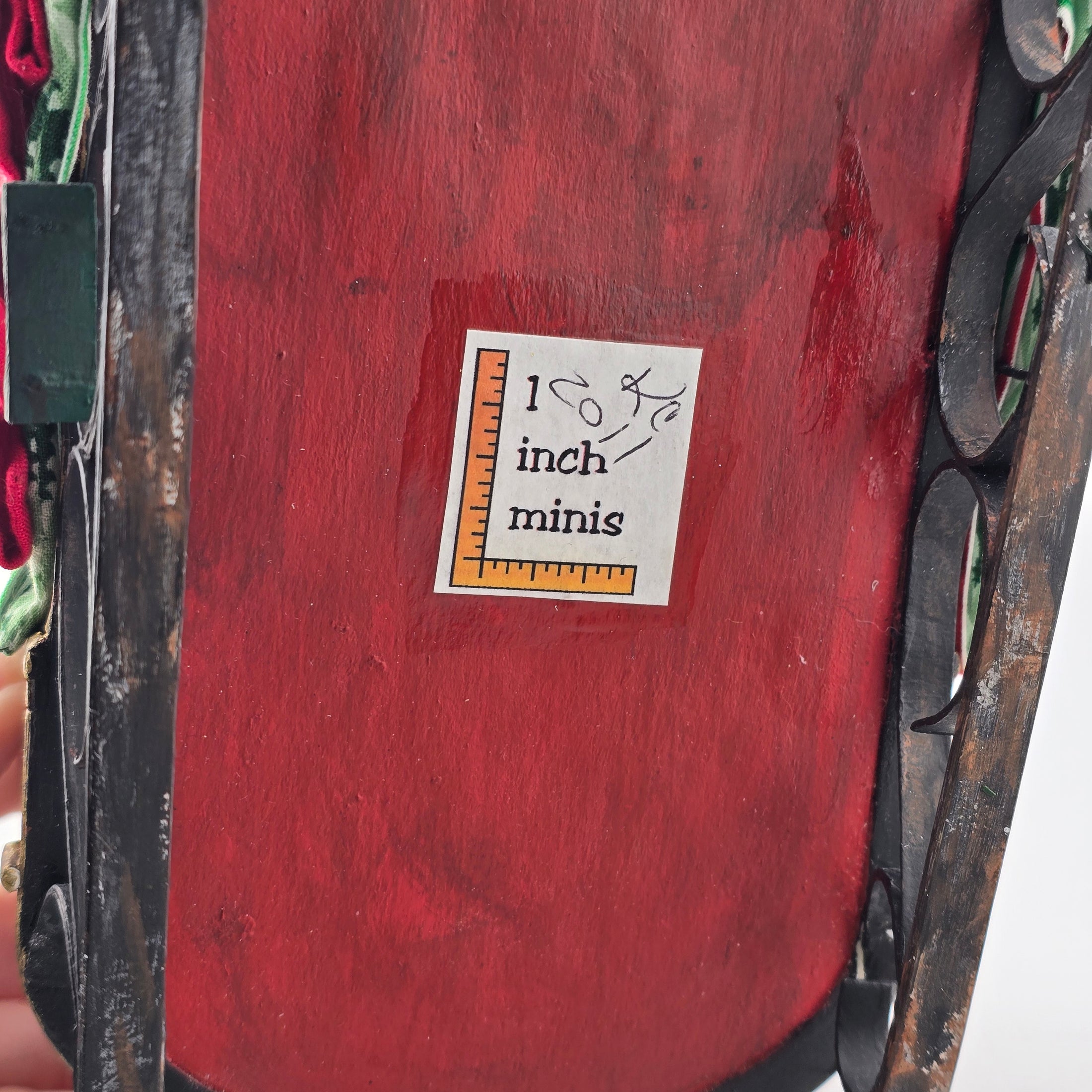 Signed underside of Sleeping miniature dollhouse santa in bed by Kris Compas of 1 inch minis