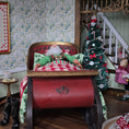 Load image into Gallery viewer, Santa Claus in a sleigh bed with a decorated Christmas tree in a festive room.
