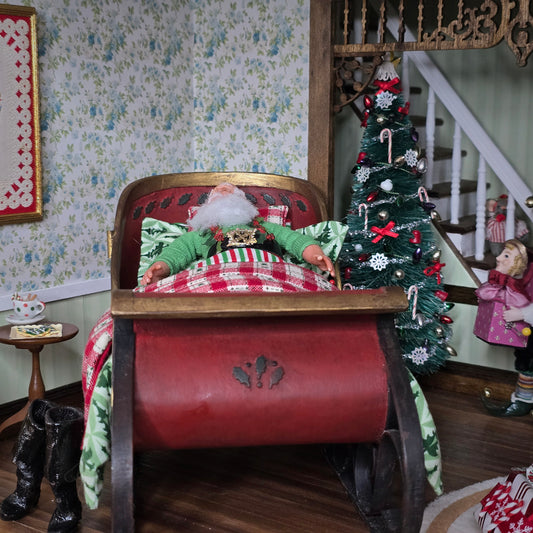 Santa Claus in a sleigh bed with a decorated Christmas tree in a festive room.