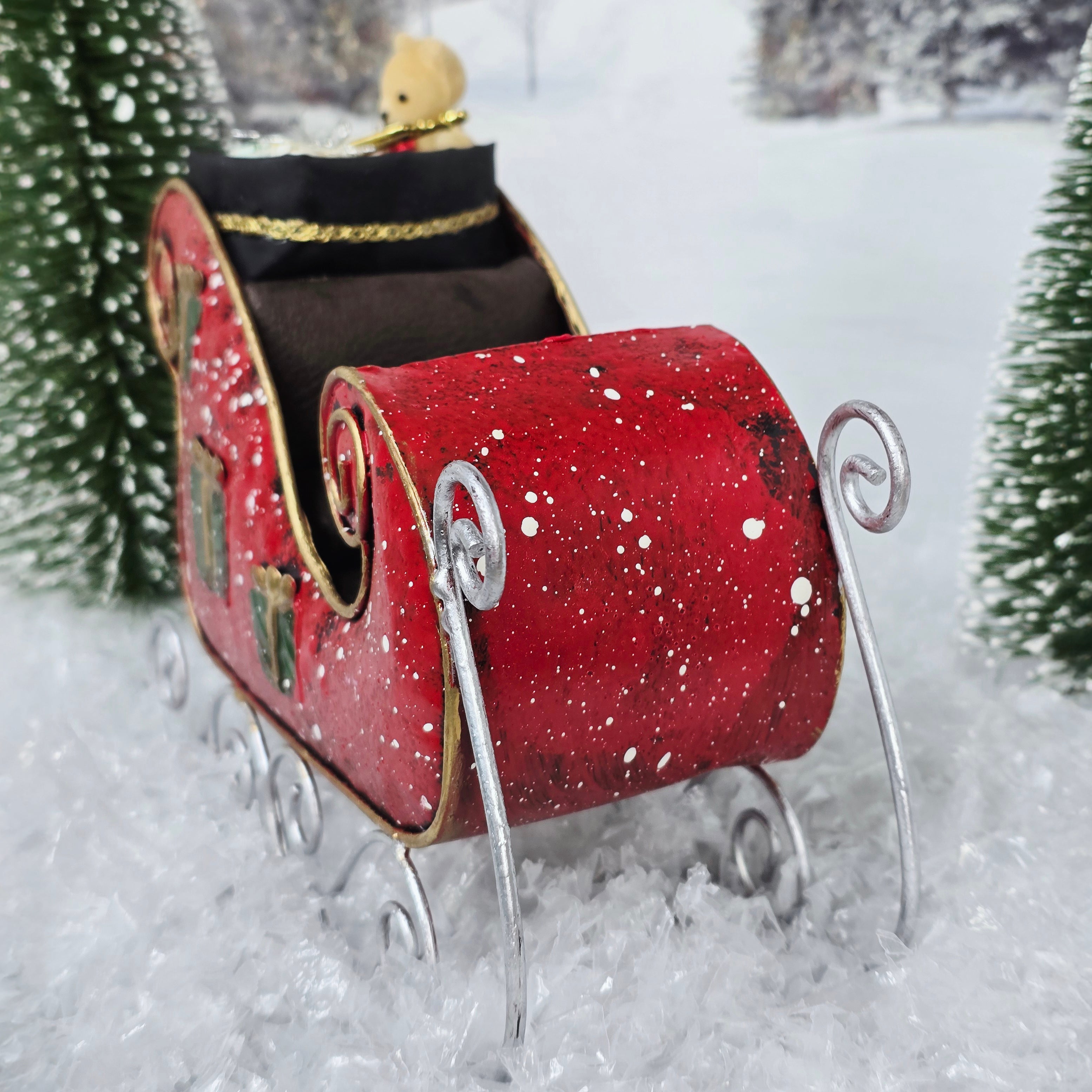 Red sleigh in a snowy background