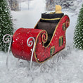 Load image into Gallery viewer, Red Christmas sleigh with decorative elements on a snowy background
