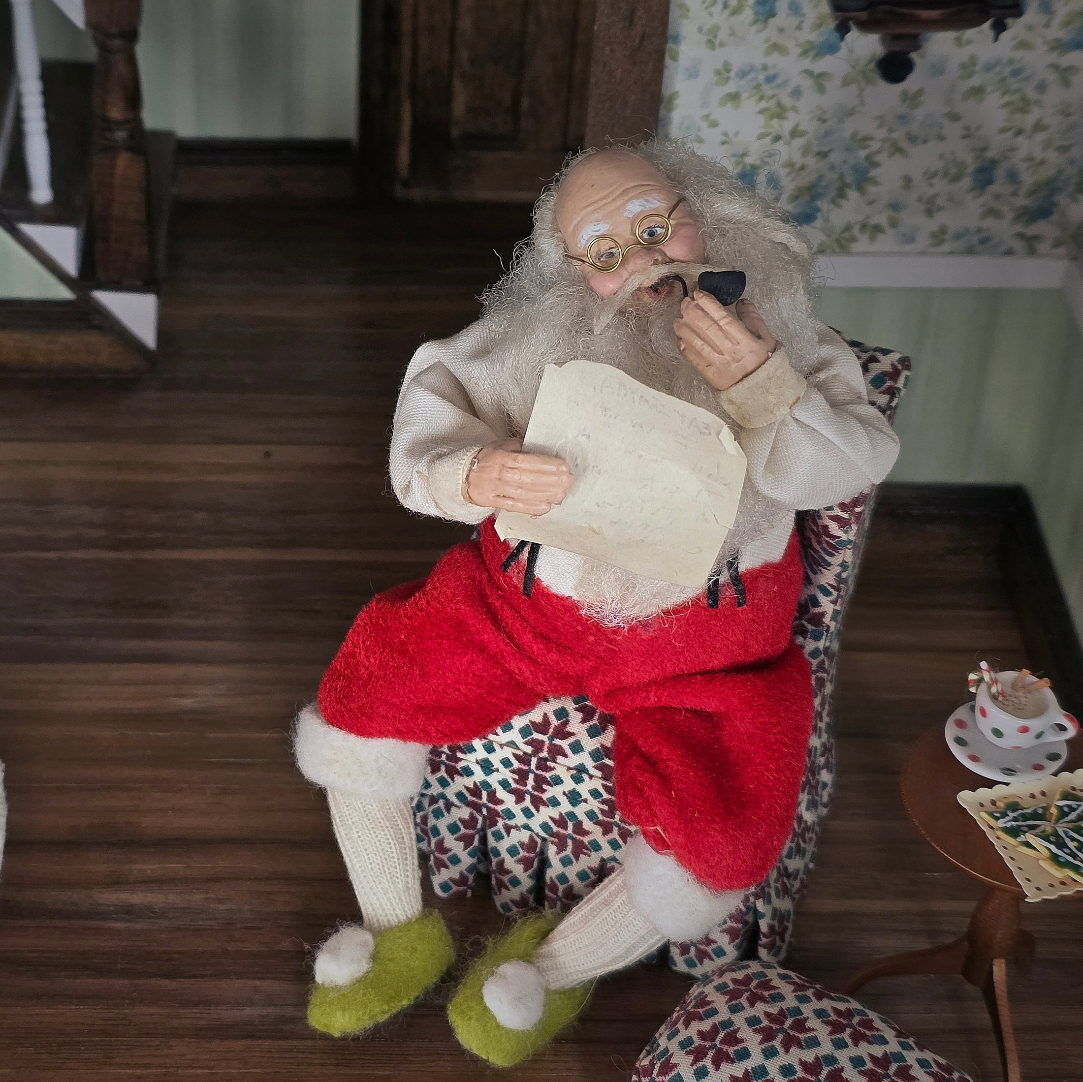 Santa Claus doll reading a child's letter