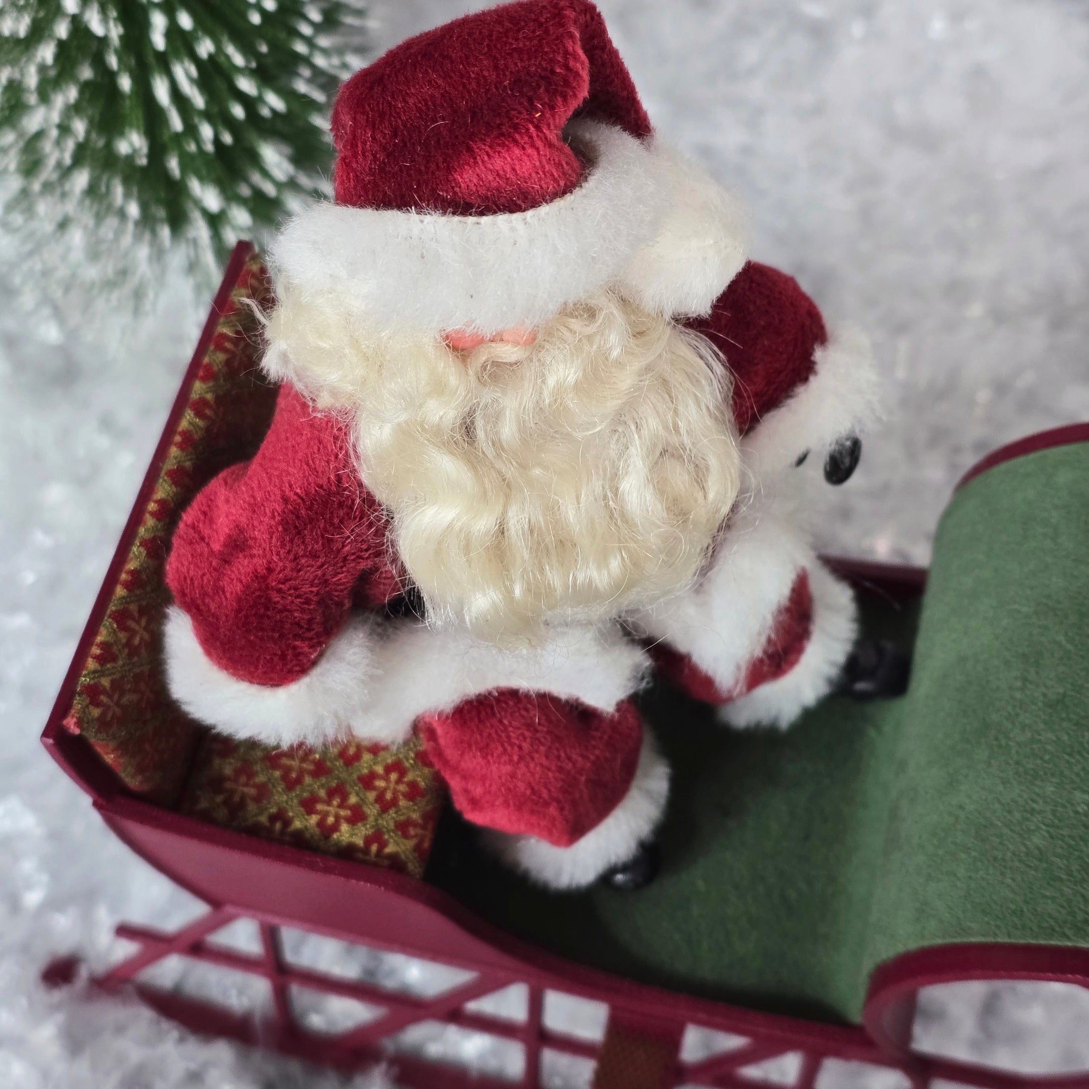 top view of Santa dollhouse doll in his sleigh