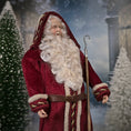 Load image into Gallery viewer, Santa Claus doll with a long white beard and red coat in a snowy scene.
