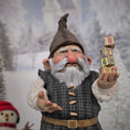 Load image into Gallery viewer, Sharon Cariola Elf dollhouse doll with a winter background featuring trees and a castle.
