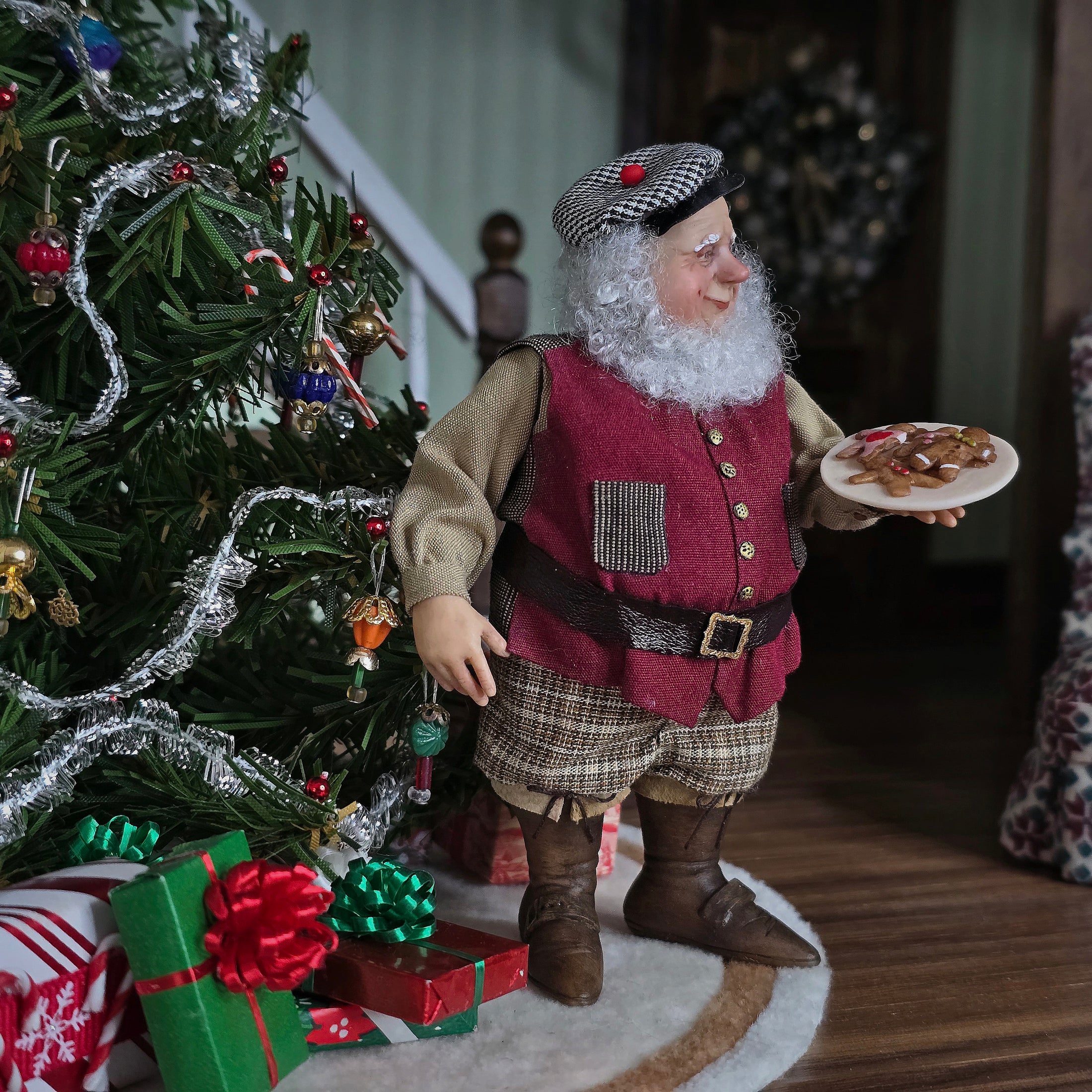 Old Christmas Elf doll holding a plate near a decorated Christmas tree.