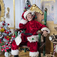 Load image into Gallery viewer, Santa dollhouse doll in a decorative room with Christmas trees and ornaments.
