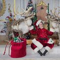 Load image into Gallery viewer, Santa dollhouse doll sitting between two reindeer with Christmas decorations in the background.
