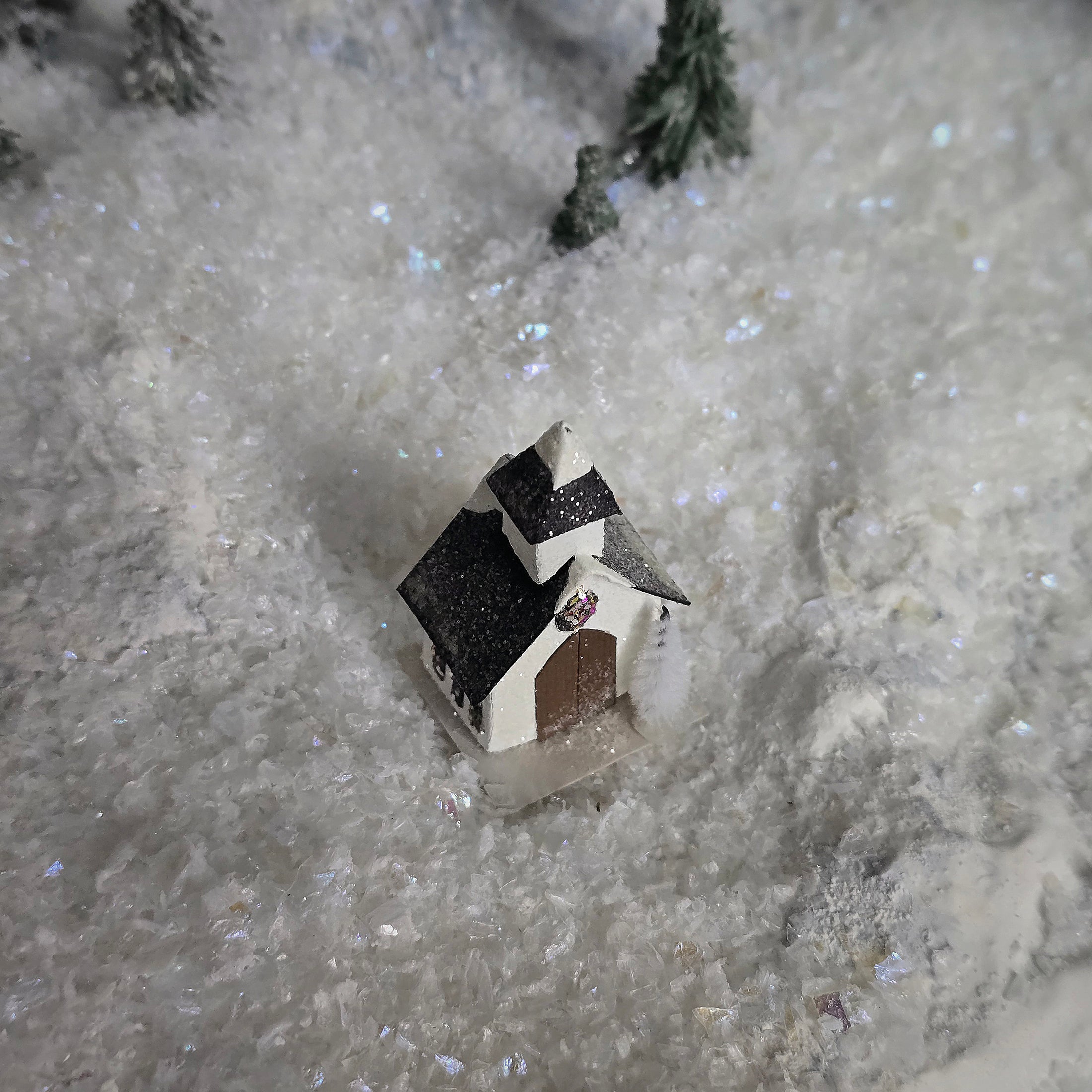 Small model church on a snowy surface