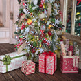 Load image into Gallery viewer, Decorated Christmas tree with ornaments and presents on a wooden floor.
