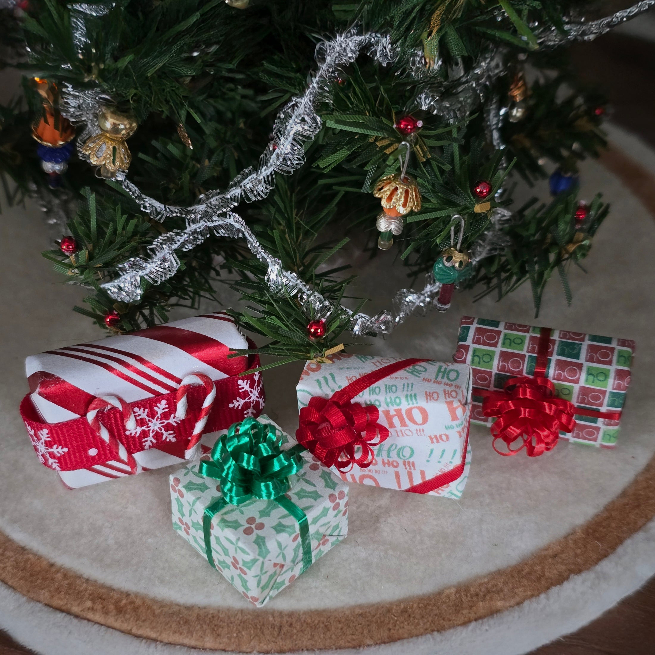 group of miniature dollhouse wrapped Christmas gifts