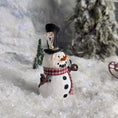 Load image into Gallery viewer, Decorative snowman figurine with a top hat and scarf in a snowy setting
