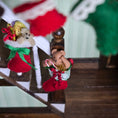 Load image into Gallery viewer, Decorative teddy bears with Christmas accessories on a staircase
