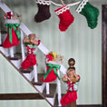 Load image into Gallery viewer, Decorative Christmas stockings with teddy bears on a staircase.
