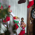 Load image into Gallery viewer, Decorative Christmas stockings with festive elements on a wooden surface.
