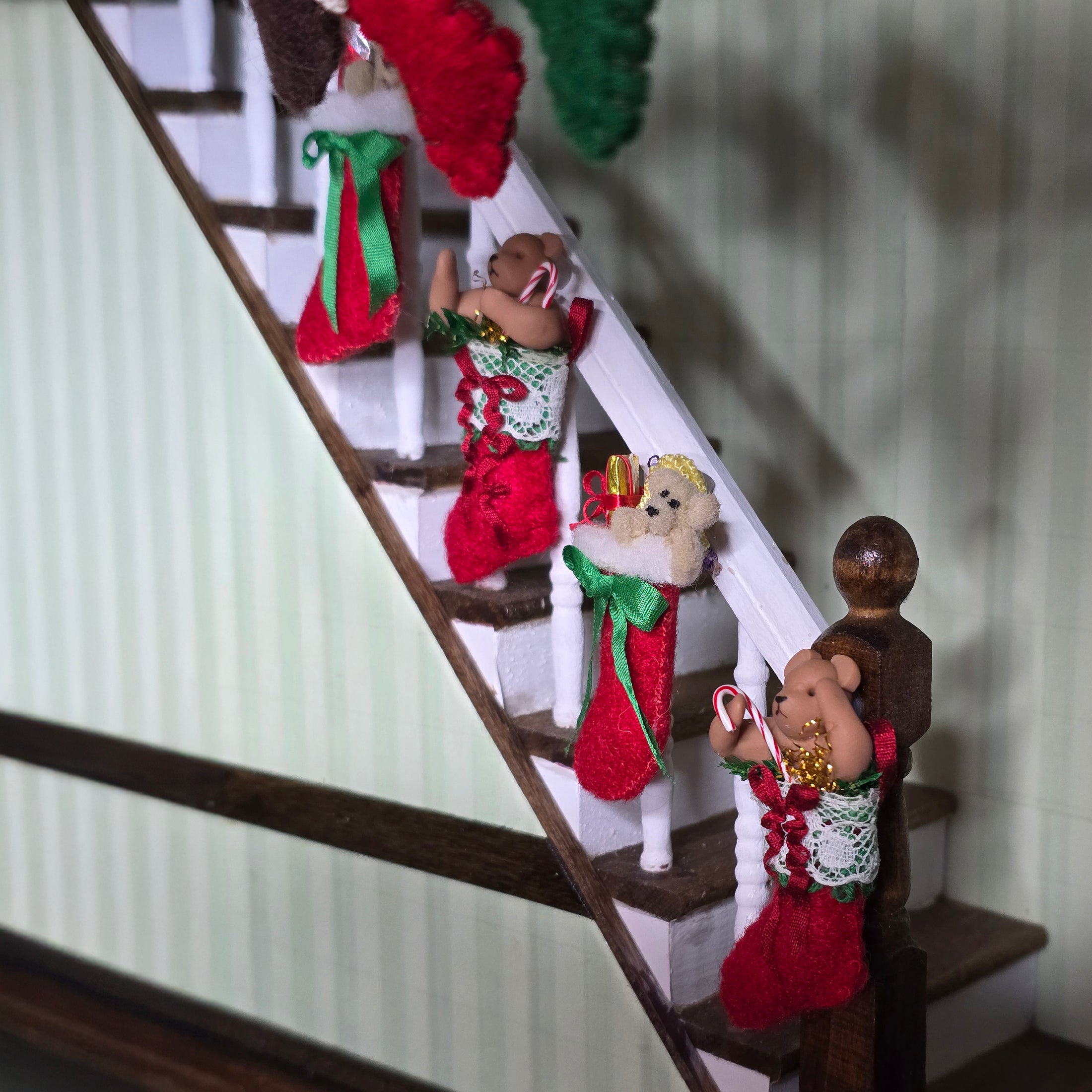 Christmas stockings with teddy bears on a staircase