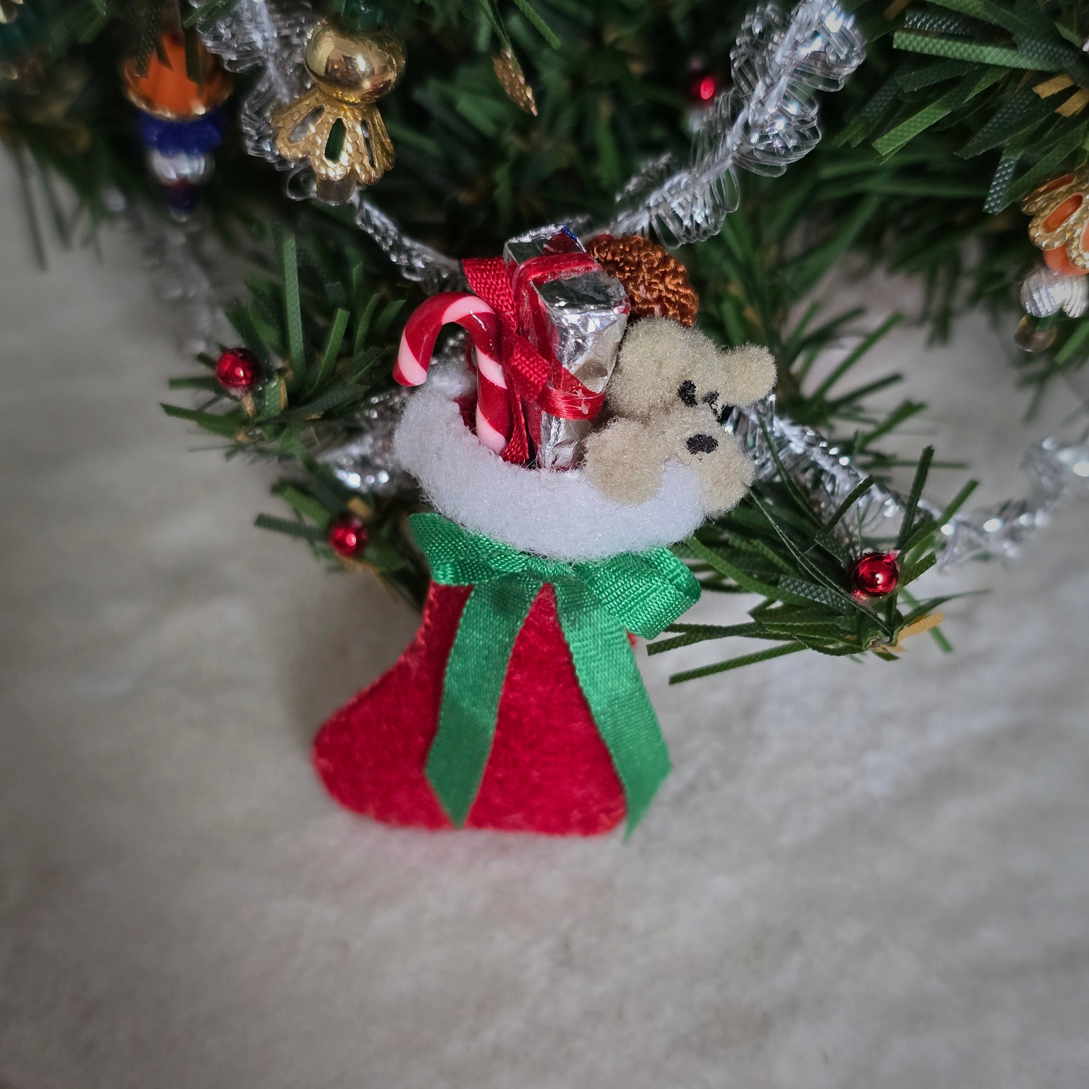 a filled miniature dollhouse stocking 