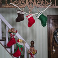 Load image into Gallery viewer, Decorative Christmas stockings hanging above a staircase
