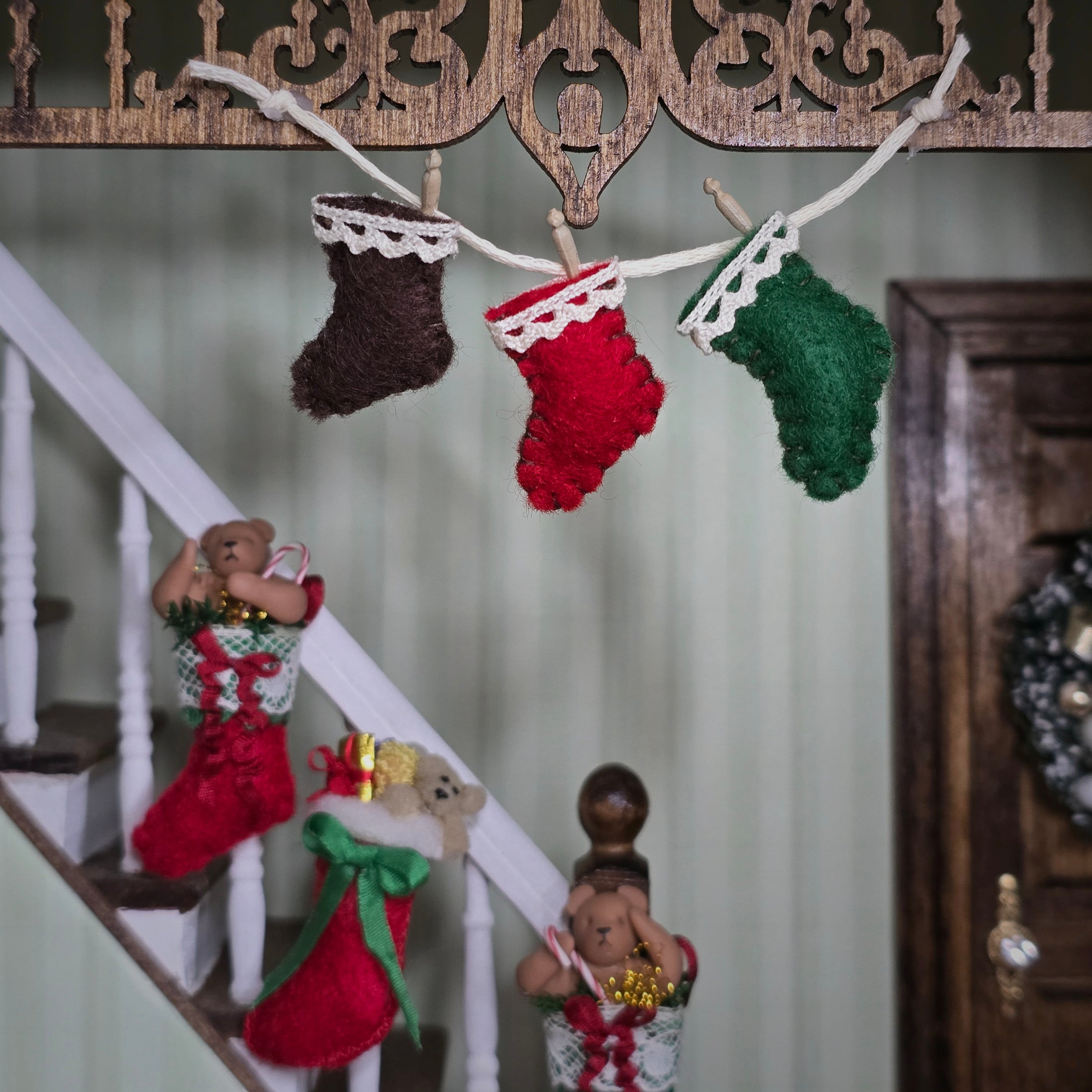 Decorative Christmas stockings hanging above a staircase