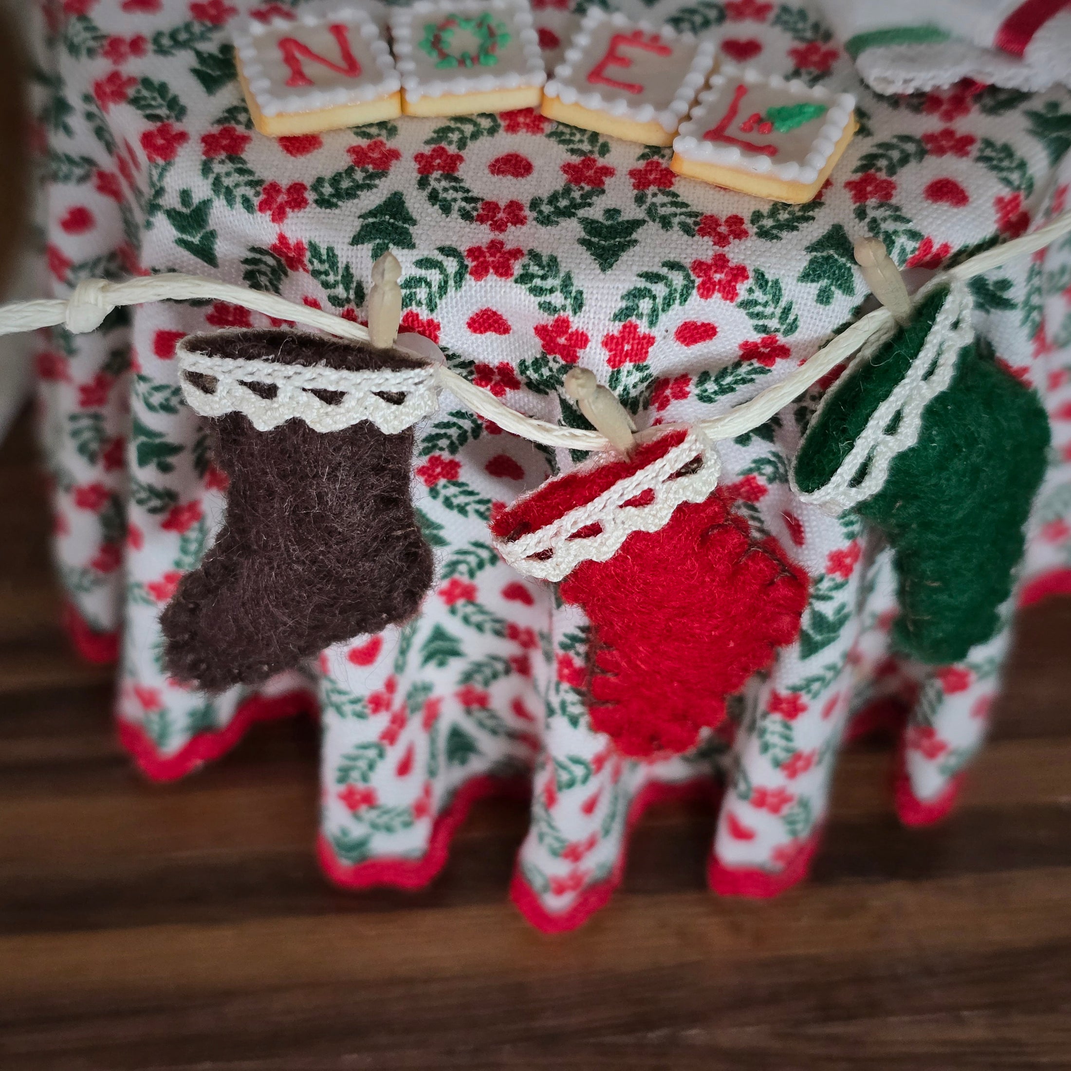 Decorative felt stockings on a floral fabric background