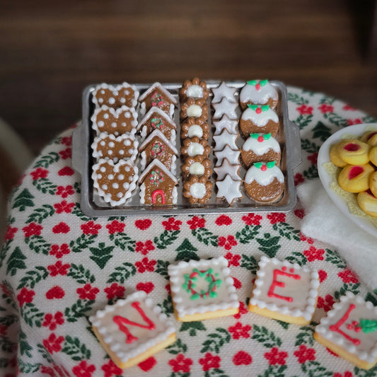 Decorative gingerbread cookies on a festive tablecloth 