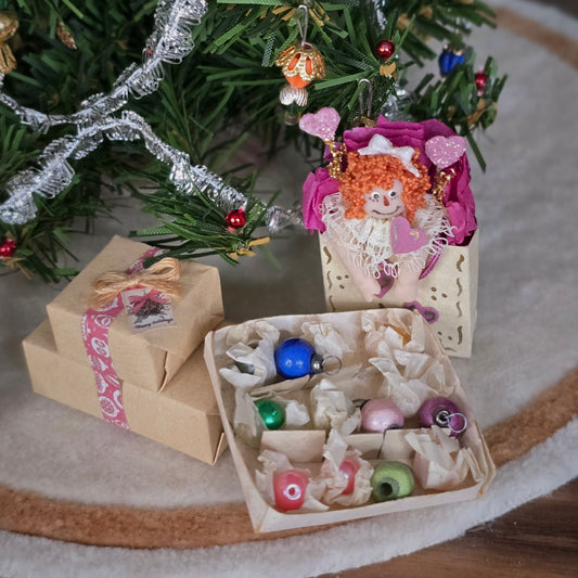 Dollhouse miniatures with decorative box with colorful ornaments 
