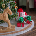 Load image into Gallery viewer, four miniature dollhouse gifts tucked underneath a christmas tree!
