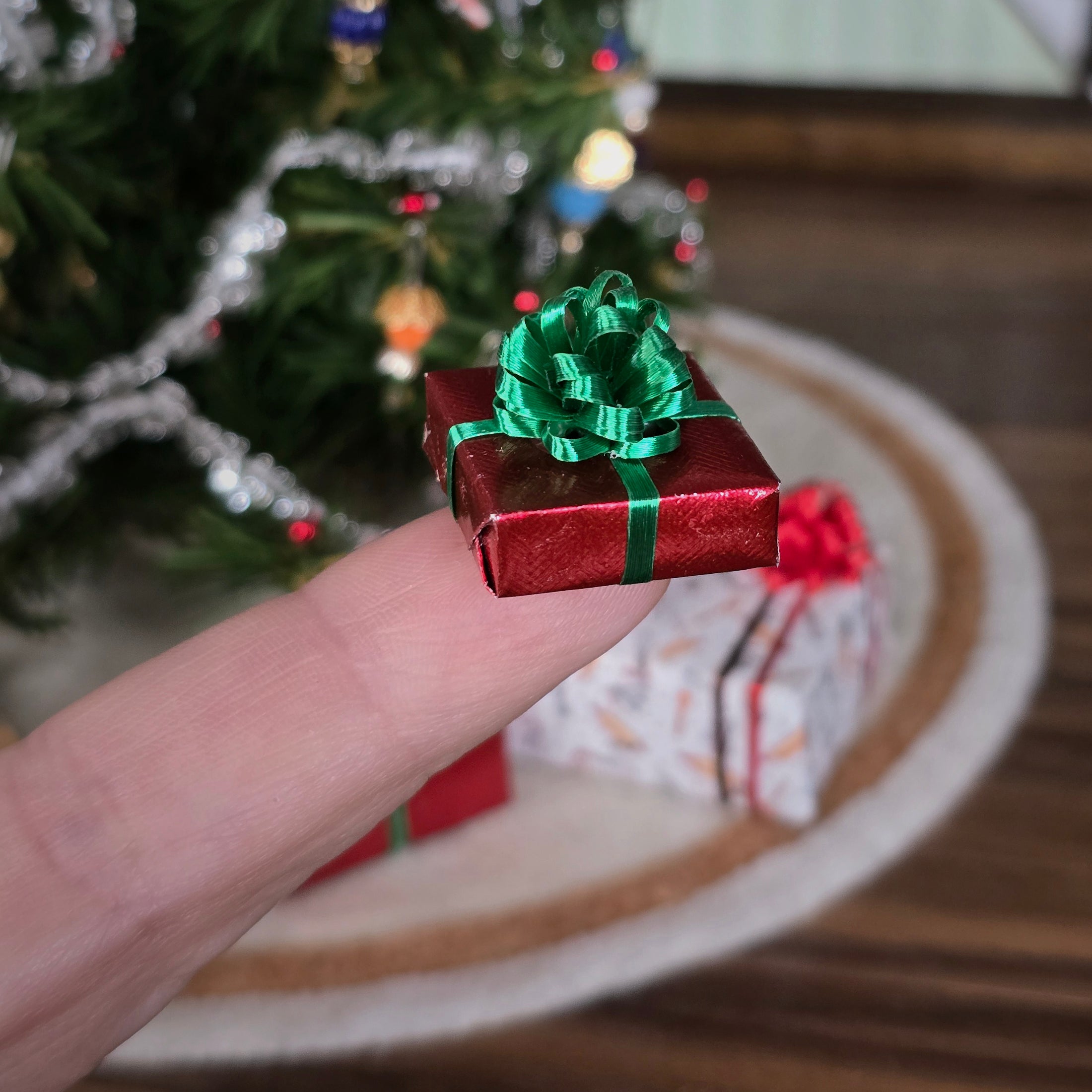small wrapped gift balancing on a finger