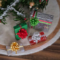 Load image into Gallery viewer, Miniature Christmas presents with ribbons on a wooden surface

