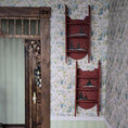 Load image into Gallery viewer, pair of Wooden ladder shelves with decorative Christmas trees against a floral wallpapered wall.

