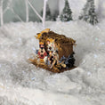 Load image into Gallery viewer, Miniature scene of a couple in a wooden sleigh on a snowy landscape
