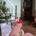 Load image into Gallery viewer, Pull toy duck balanced on a finger
