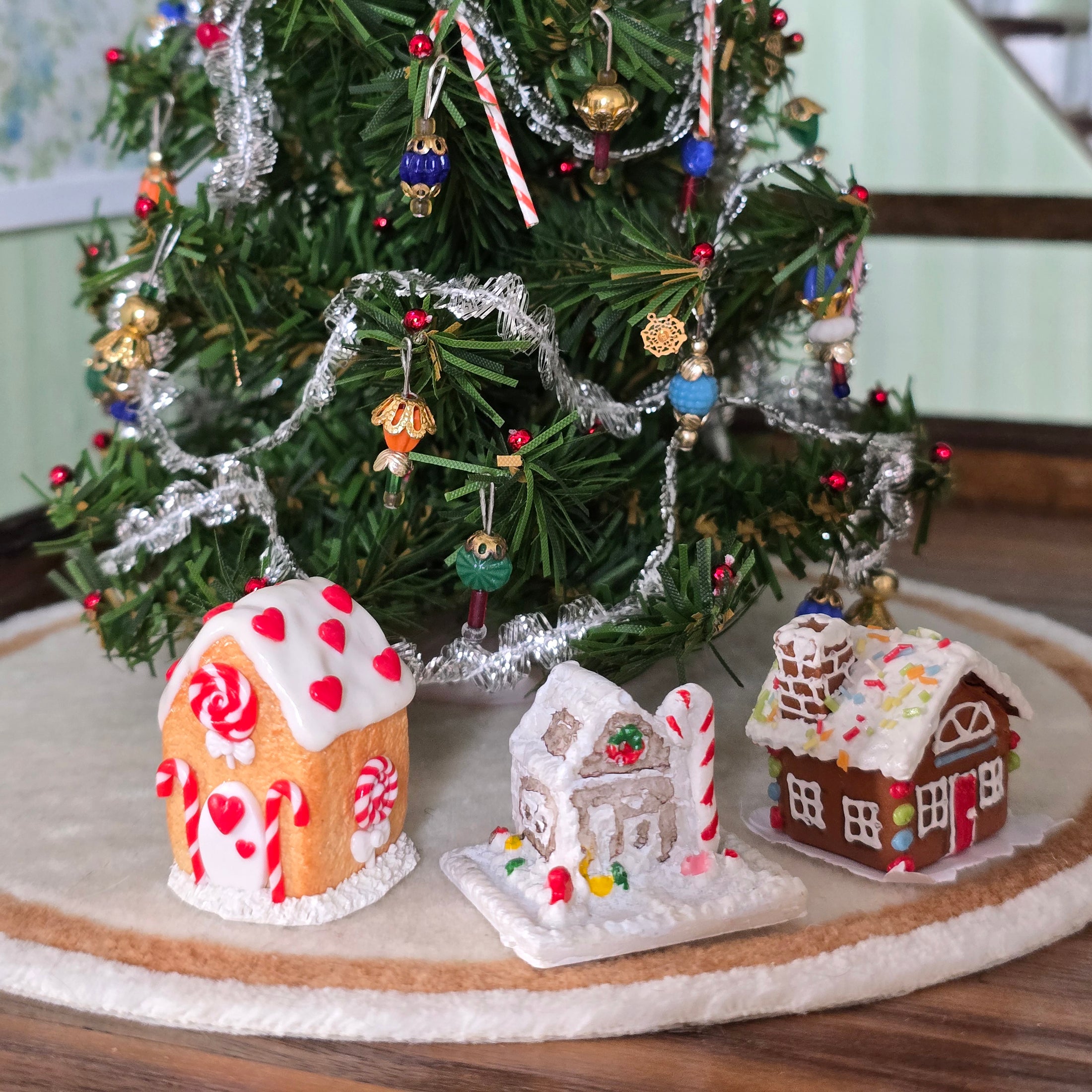 miniature gingerbread houses, under christmas tree