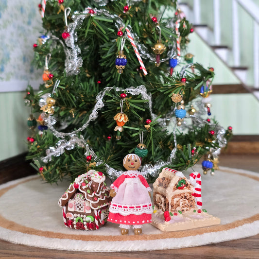 gingerbread miniatures in front of christmas tree