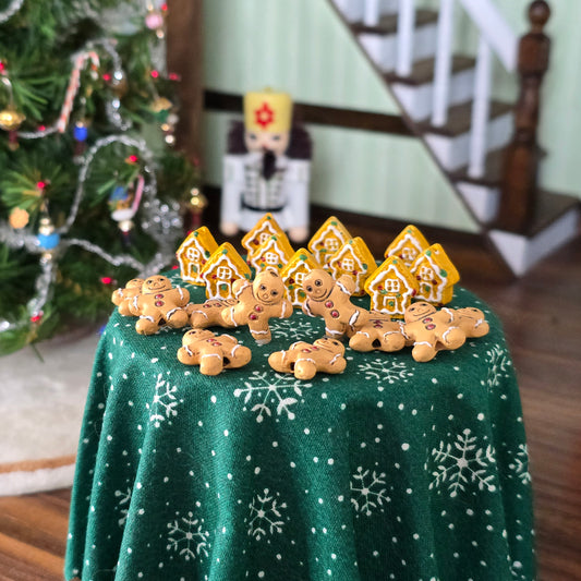 miniature gingerbread men and houses on table