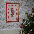 Load image into Gallery viewer, Framed miniature embroidered Victorian Santa Claus, hanging on wallpapered wall
