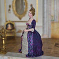 Load image into Gallery viewer, Gale Elena Bantock doll in a purple dress against a decorative background
