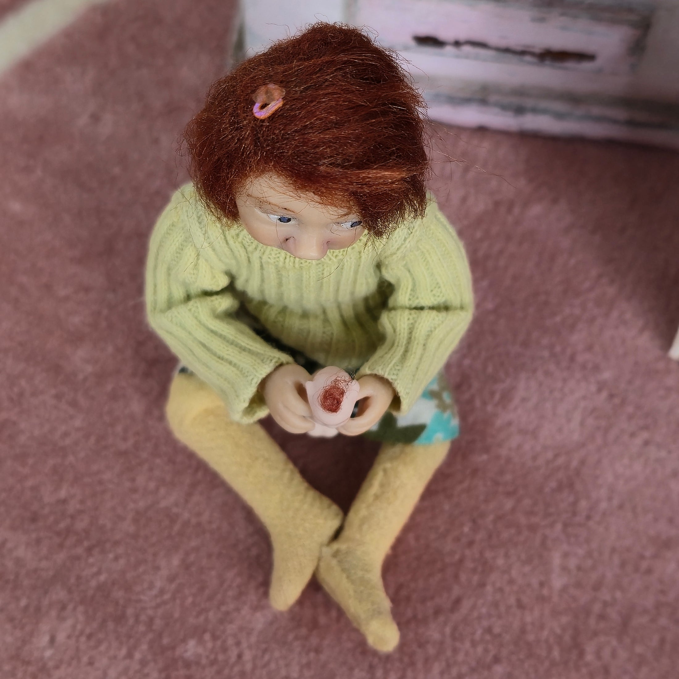 Catherine Muniere doll wearing a sweater
