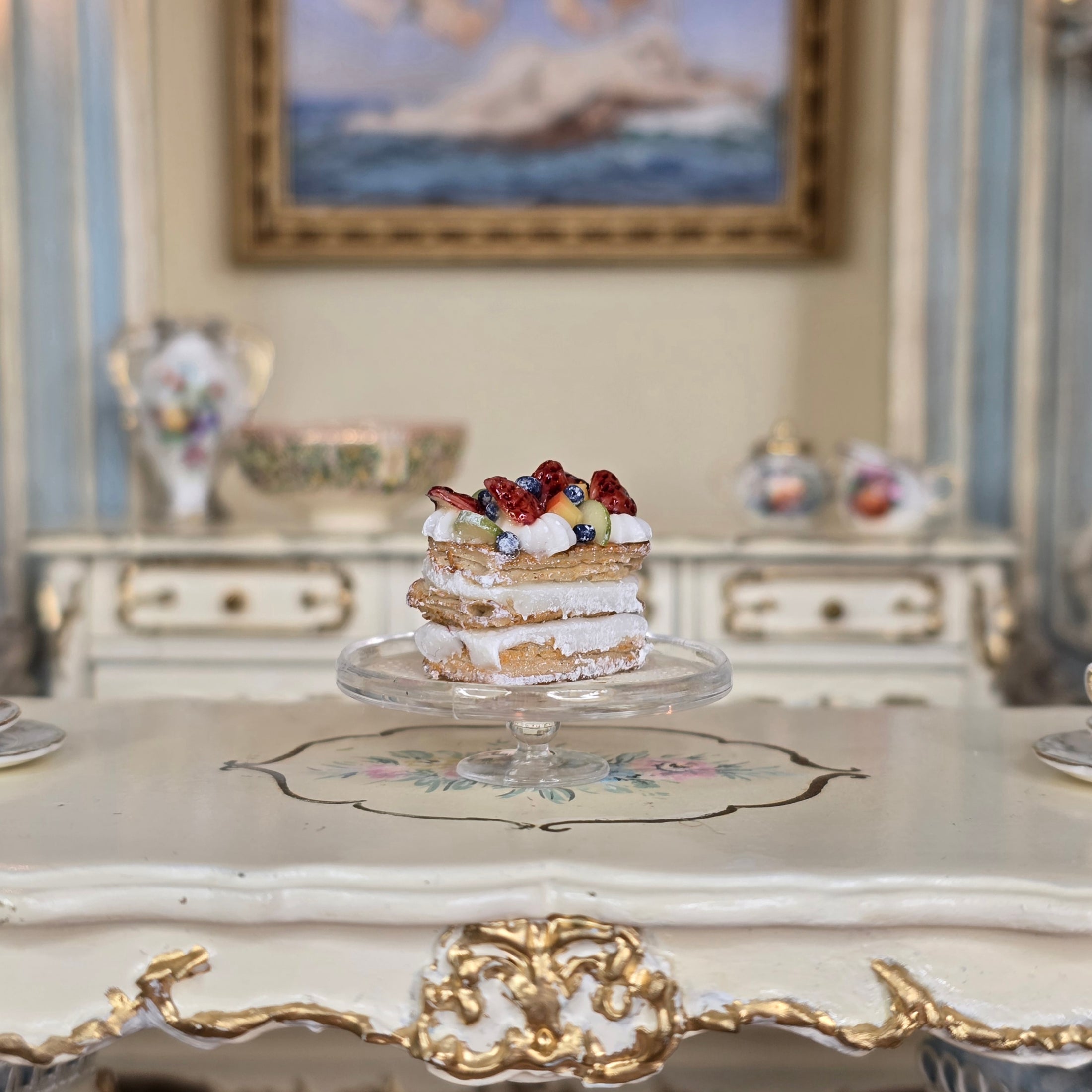 miniature pastry with fruit on a decorative table in an elegant room.