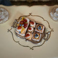 Load image into Gallery viewer, Decorative silver tray with small pastries on a decorative plate
