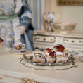 Load image into Gallery viewer, Miniature pastries on a silver tray with a decorative background
