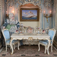 Load image into Gallery viewer, Decorative interior with ornate furniture, a doll, and decorative items.
