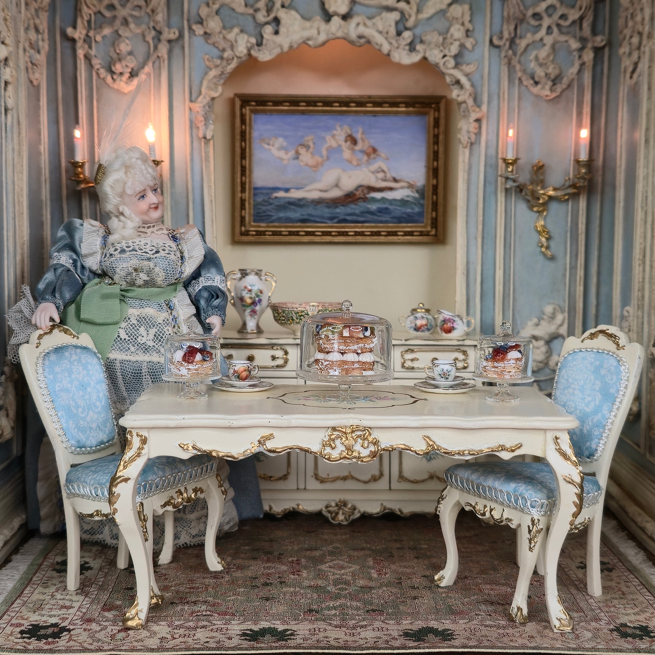Decorative interior with ornate furniture, a doll, and decorative items.